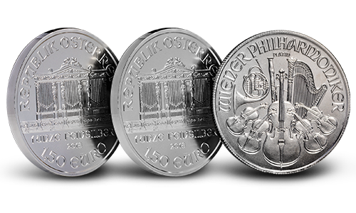 Three Austrian Silver Philharmonic coins, two displaying the obverse and one displaying the reverse.