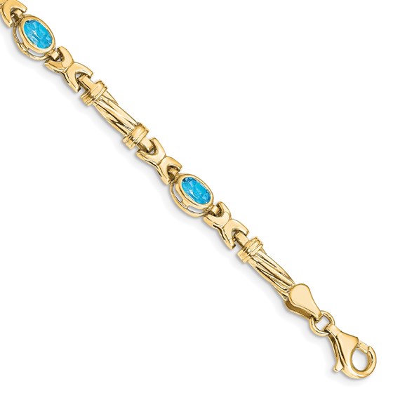 10K Yellow Gold Blue Topaz 4 Stone Bracelet - 7.25 in.